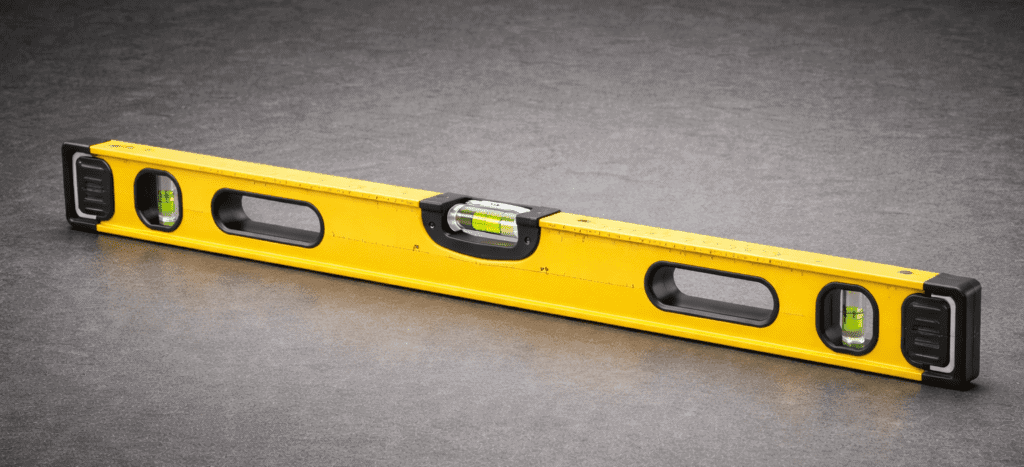 Yellow spirit level for accurate measurements in home renovation tasks.